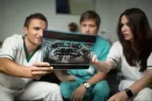 Orthodontist reviewing digital scans before changing treatment methods